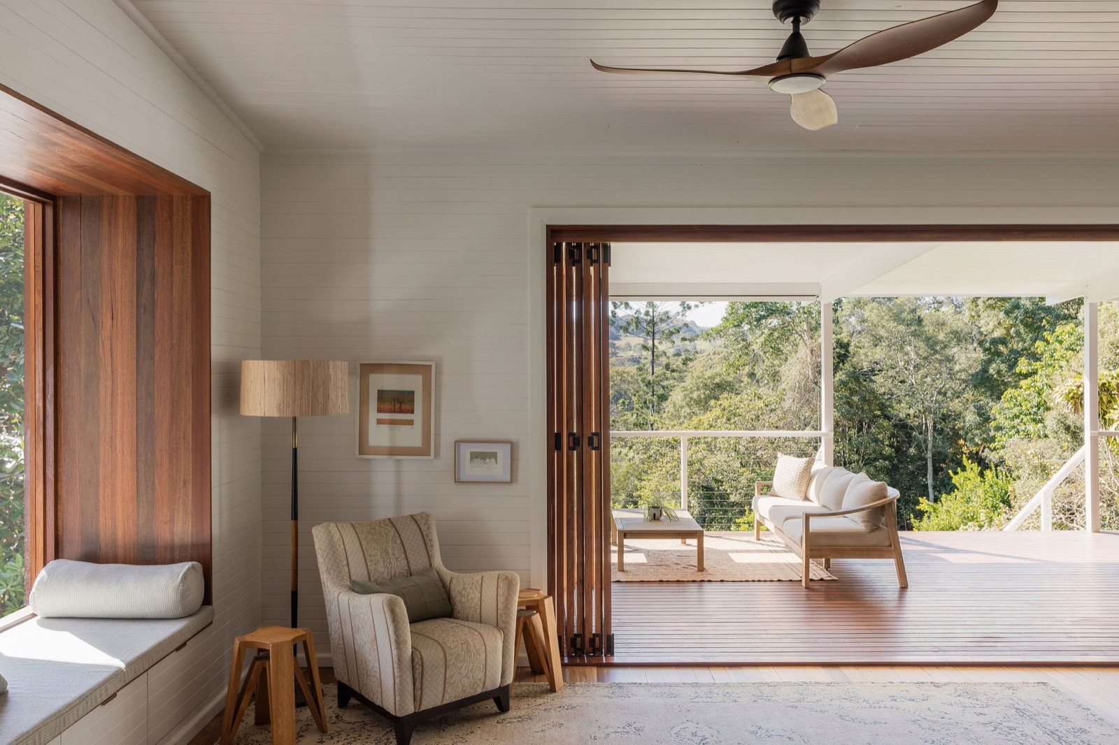 Wildwood living room by Muskens Building Co. - open-plan living opening to the deck